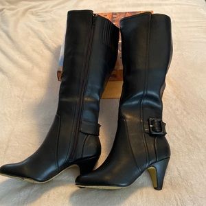Women’s black high heeled boots. Size 7. Never worn.